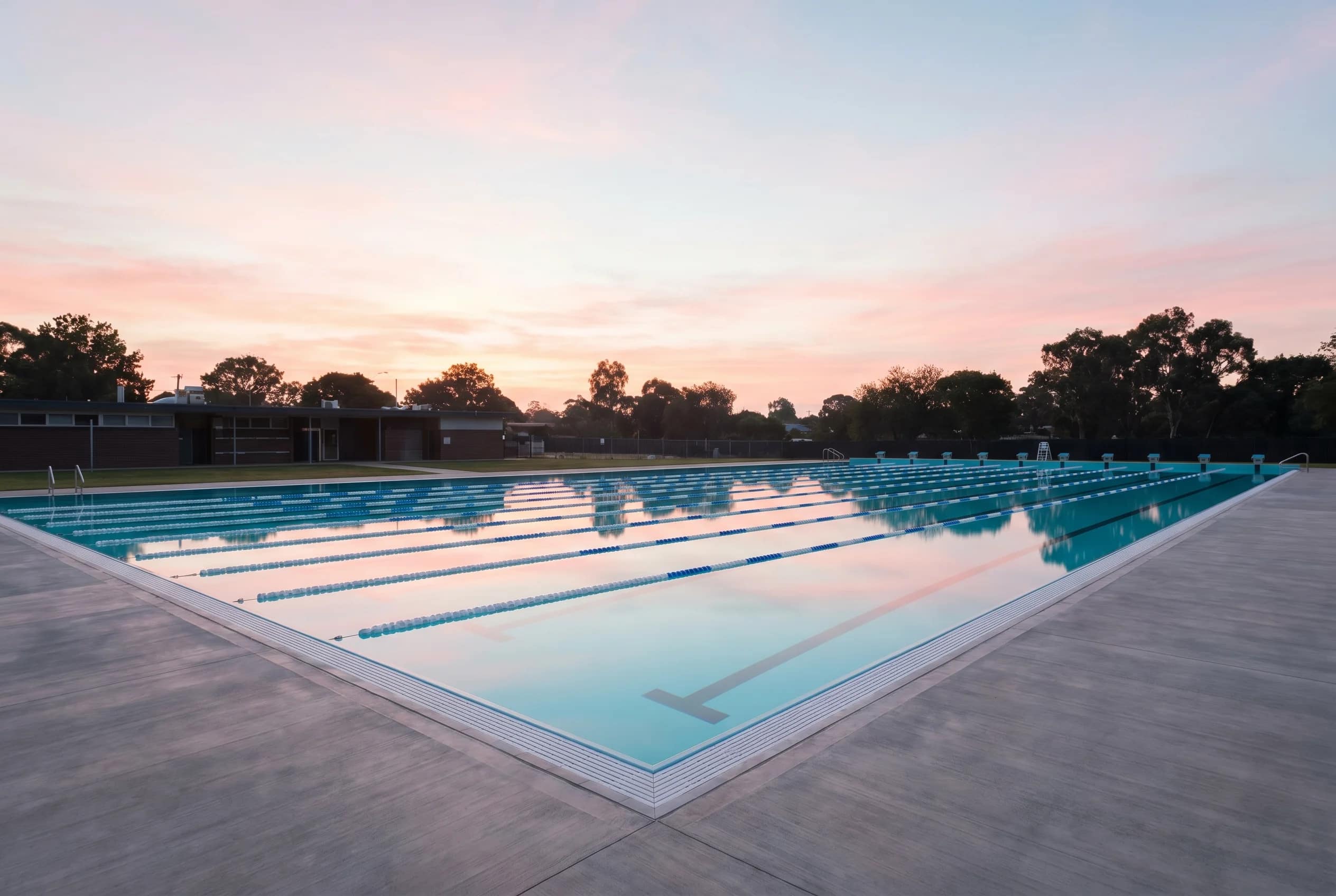A quiet outdoor pool at dawn